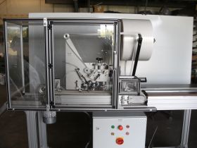 Adhesive tape application machine for fire protection strips